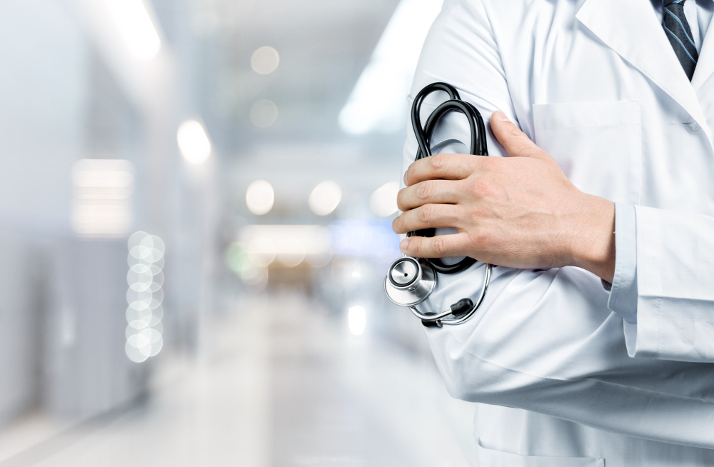 doctor-with-black-stethoscope-hospital-background